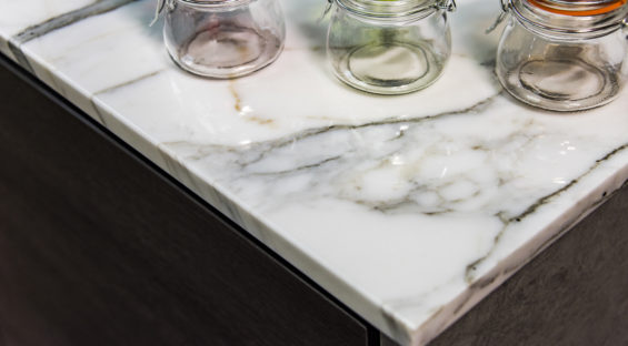 Marble. Stone marble. Kitchen counter top made of marble stone material. Stone worktop made of marble. Carrera Marble stone. Marbled stone surface.